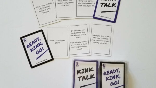 A display of the Kink Talk deck cards and Ready, Kink, Go! deck cards splayed out.