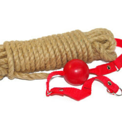 Spool of rope with a red ball gag next to it.