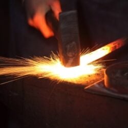 Hammering hot steel