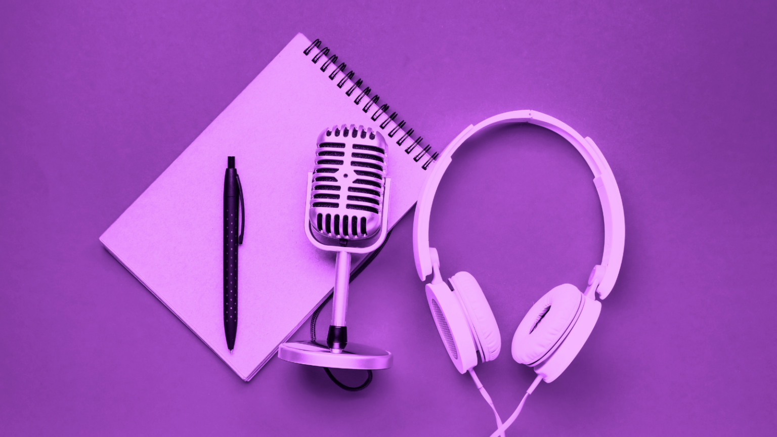 Headphones, microphone, notebook, and pen on purple background